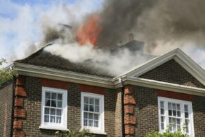 A house with the roof on fire.